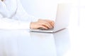 Close-up of business woman hands typing on laptop computer. Secretary at work in office Royalty Free Stock Photo