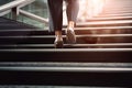 Close-Up of Business Woman\'s Feet Climbing Stairs to Achieve Goals. created with Generative AI