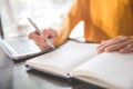 close up of business womans hands using laptop and writing Royalty Free Stock Photo