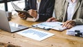 Close up business women working together on contract documents, happy meeting with colleagues to plan new projects in the office Royalty Free Stock Photo