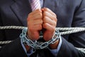 Close up of a businessman with chains in his hands, in a blurred background Royalty Free Stock Photo