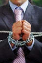 Close up of a businessman with chains in his hands, in a blurred background Royalty Free Stock Photo