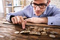 Close-up Of A Businessman Counting Coins