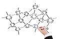 Close up of businessman drawing molecules