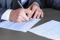 Close up.businessman filling out the contract form. Royalty Free Stock Photo