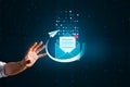 Close up of businessman hand holding glowing mail notification on dark background. Newsletter, social media and communication