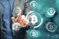 Close up of businessman hand pointing at abstract glowing bitcoin hologram interface on blurry bokeh background. Cryptocurrency Royalty Free Stock Photo