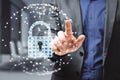 Close up of businessman hand pointing at abstract glowing padlock shield inside polygonal sphere on blurry office interior Royalty Free Stock Photo