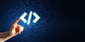 Close up of businessman hand pointing at glowing programming code on blue binary coding background with mock up place. Program and Royalty Free Stock Photo