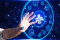 Close up of businessman hand using creative round medical interface with cross and other icons on blue background. Healthcare and Royalty Free Stock Photo