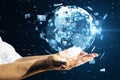 Close up of businessman hands holding creative globe with telecommunication picture icons. Business, video conference, remote