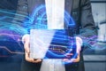 Close up of businessman hands holding pad with creative glowing blue euro sign hologram on blurry office interior background. Royalty Free Stock Photo