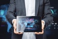 Close up of businessman hands holding tablet with creative global forex chart on dark background. Concept of stock market and Royalty Free Stock Photo