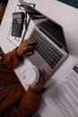 close up Businessman hands searching for data on Notebook with analyzing charts at his workplace. Royalty Free Stock Photo