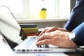 Close-up of businessman hands using the keypad of a laptop Royalty Free Stock Photo