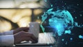 Close up of businessman hands using laptop computer with glowing money transfer globe on blurry background. Currency and stock Royalty Free Stock Photo