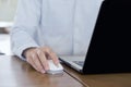 Close up, Businessman hands using mouse and computer laptop, browsing internet information and searching web, working outside Royalty Free Stock Photo