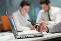 Close up of businessman hands using smart phone on meeting Royalty Free Stock Photo