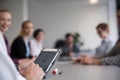 Close up of businessman hands using tablet on meeting Royalty Free Stock Photo