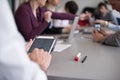 Close up of businessman hands using tablet on meeting Royalty Free Stock Photo