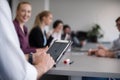 Close up of businessman hands using tablet on meeting Royalty Free Stock Photo