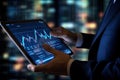 Close up of businessman hands using tablet with stock market chart on screen, Businessman hand close up using tablet with stock