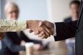 Close up of businessman handshake intern greeting with promotion