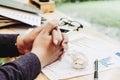 Close up businessman Hold hands with document on wood table