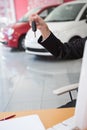 Close up of businessman holding car key Royalty Free Stock Photo