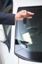 Close up of businessman holding car key Royalty Free Stock Photo