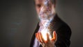 Close up of Businessman holding glowing DNA helix with energy sp