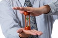 Close up of businessman holding hourglass between his hand Royalty Free Stock Photo