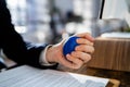 Close-up Of Businessman Holding Stress Ball Royalty Free Stock Photo