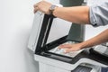 Businessman lift the office printer plate to scanning preparation