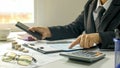 Close-up of a businessman, a man checking an accounting report, ideas for costing