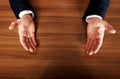 Close up of businessman open hands on the desk