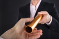 Businessman Passing A Golden Relay Baton Royalty Free Stock Photo