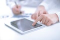 Close up.businessman pointing with pen on a digital tablet screen. Royalty Free Stock Photo