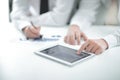 Close up.businessman pointing with pen on a digital tablet screen. Royalty Free Stock Photo