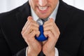 Businessman Pressing Stress Ball Royalty Free Stock Photo