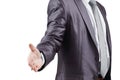 Close up. the businessman reaches out for a handshake .isolated on grey background Royalty Free Stock Photo