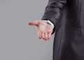 Close up. the businessman reaches out to the partner . on grey background Royalty Free Stock Photo