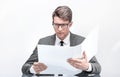 Close up. businessman reading documents sitting at his Desk Royalty Free Stock Photo