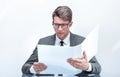 Close up. businessman reading documents sitting at his Desk Royalty Free Stock Photo