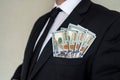 close-up of businessman& x27;s hand in branded suit holding dollar banknotes. Royalty Free Stock Photo