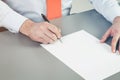 Close up of businessman's hand intending to write a document, petition or claim. A concept of drafting documentation process. Royalty Free Stock Photo