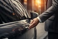 Close up of businessman's hand opening car door. Car rental concept Royalty Free Stock Photo
