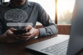 businessman's fingers on smartphone screen using SEO tools to promote online content Royalty Free Stock Photo