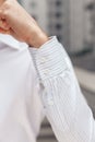 Close up of a businessman showing a shirt cuff