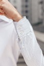 Close up of a businessman showing a shirt cuff